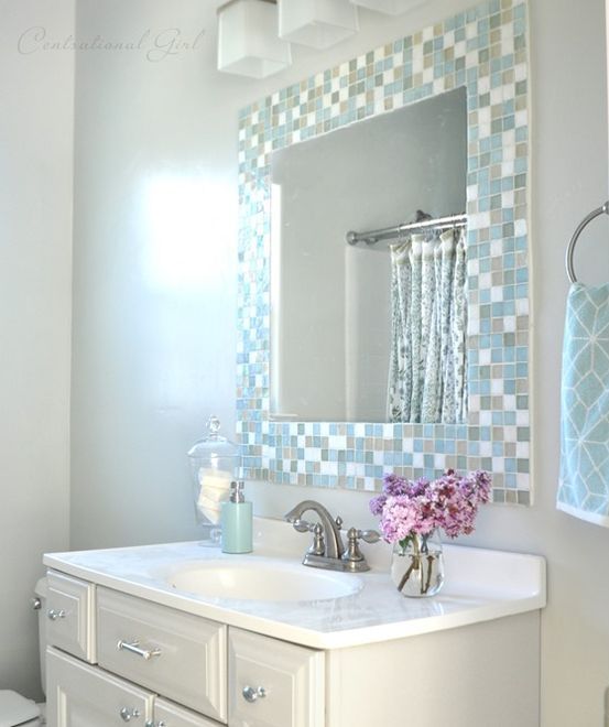 subtle mosaic tiles around the mirror