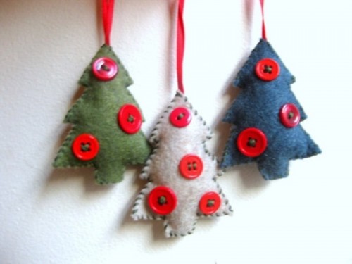 Felt tree shaped Christmas ornaments with red buttons are lovely for tree decor and can be given as simple and pretty gifts