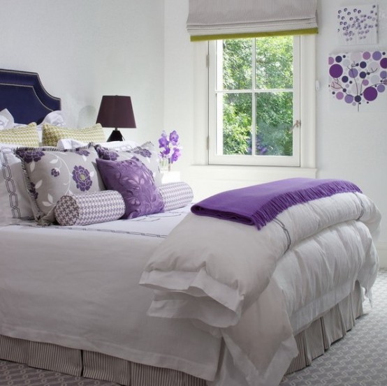 white color as the main one for bedroom decor make the space look larger and more welcoming, and bold purple add a contrasting touch to the space