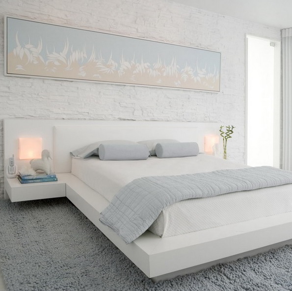 A small bedroom fully done in white and light pastels feels and looks larger and more inviting