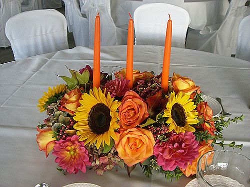 Top off a welcoming Thanksgiving table with a glowing candle centerpiece.