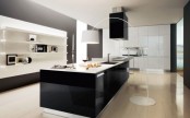 a minimalist black and white kitchen with sleek white cabinets and a large black kitchen island, a large wall unit with lots of shelves
