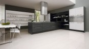 a contemporary black and white kitchen with a white shelving unit, a black kitchen island, a black shelving unit on the side and a large fridge