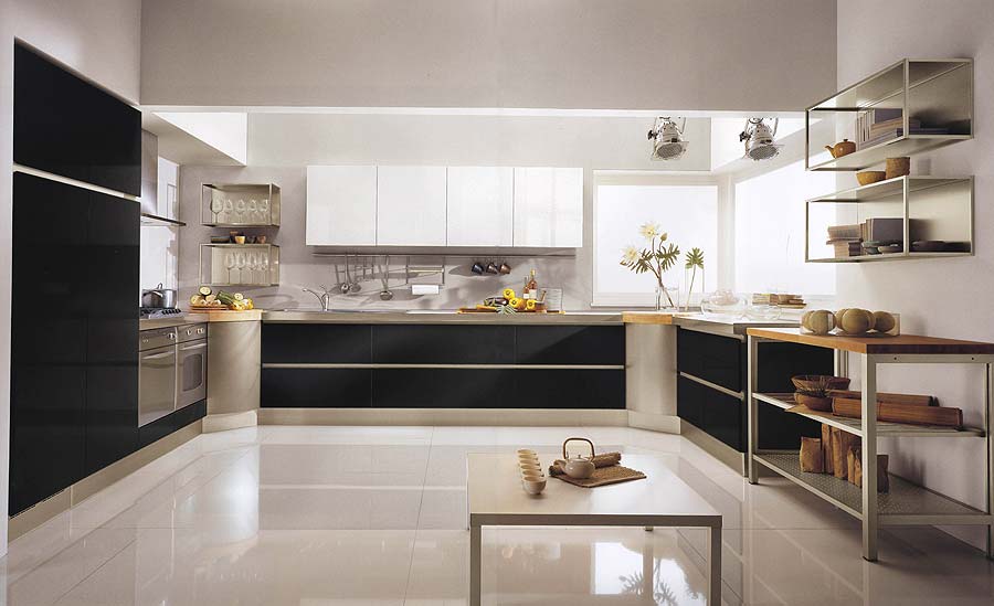 A contemporary black and white kitchen with black lower cabinets and white upper ones, an additional table like kitchen island matching shelves on the wall
