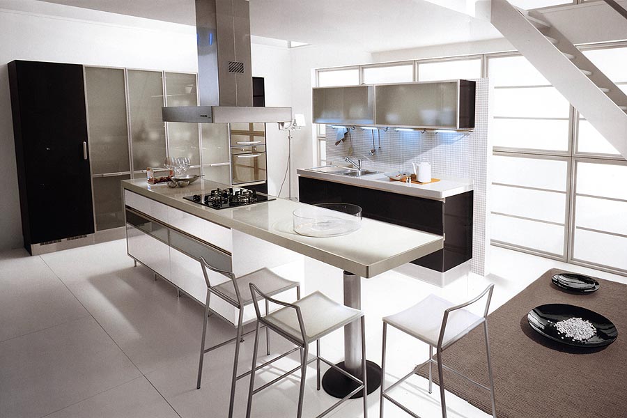 A contemporary kitchen with black lower cabinets and a large storage unit with black and sheer parts, with a table style kitchen island and chairs and stools