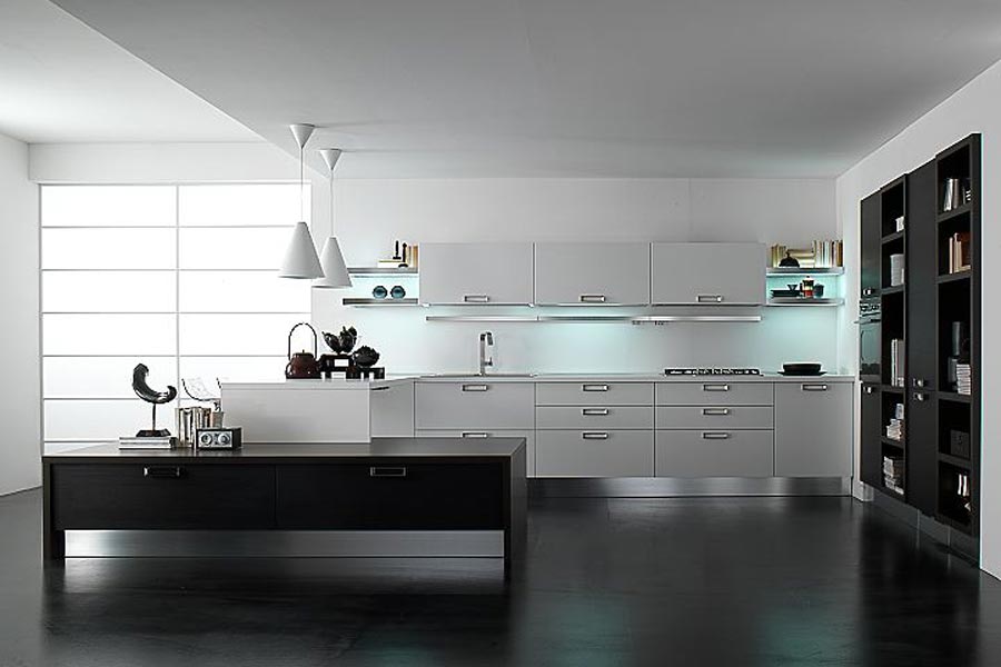 A black and white kitchen with white cabinets, white pendant lamps, a black built in storage unit and a low black table plus built in lights