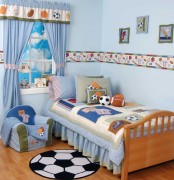 a football-themed blue kid’s room with various types of football balls and fun decor is ideal for boys