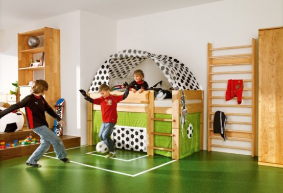 a football-inspired boy's room with a real football space to play here is a dream of all the sporty kids and those who like activities