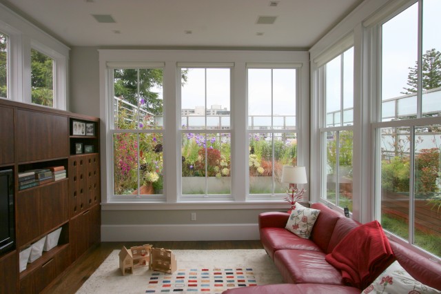 Lovely sunroom-style living room addition where kids could play.