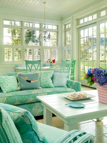 A very functional sunroom design with lovely upholstery color. Two tables could solve lots of task and could be combined for large parties.