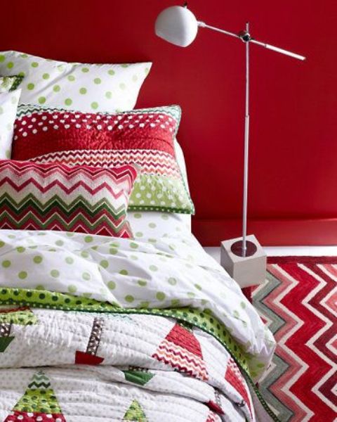 a red statement wall and red, green and white bedding for Christmas will make you feel fun and cheery