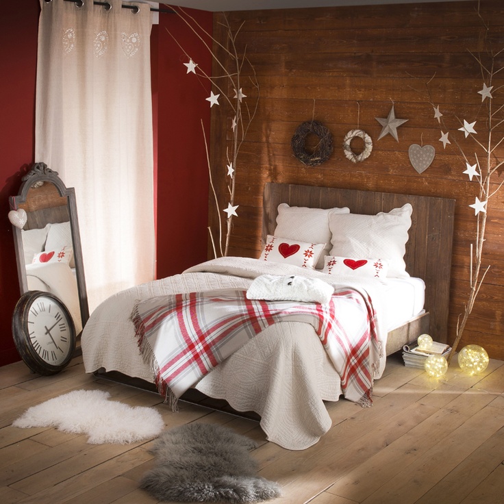 Plaid bedding, Christmas trees with heart and star ornaments hanging for a cute winter like look