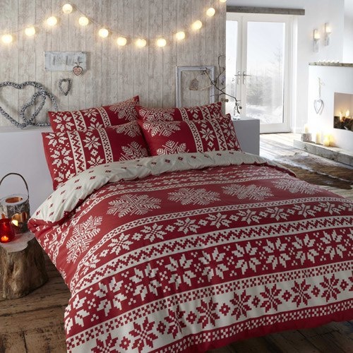 String lights, red lanterns and red and white printed Christmas bedding for a holiday like space