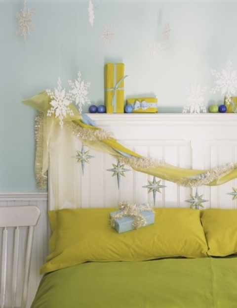 Bold neon green and yellow bedroom with snowflakes, blue ornaments and brign bedding for a non traditional look