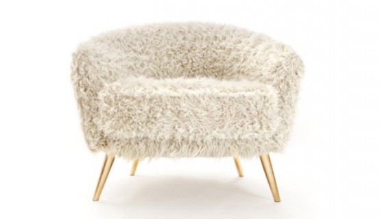 a grey faux fur chair on gold legs is a chic and cozy furniture piece to rock in any space
