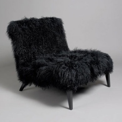 A black faux fur loveseat is a cool piece for a Gothic infused interior or just a moody space