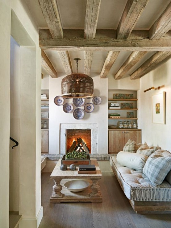 wooden beams, a fireplace and wooden rustic furniture plus built-in furniture