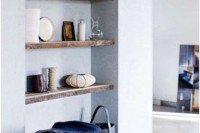 a niche with a series of wooden shelves is a lovely idea for any space, display and store whatever you like