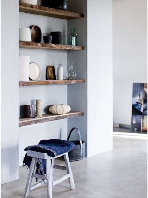 a niche with a series of wooden shelves is a lovely idea for any space, display and store whatever you like