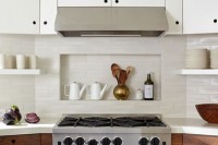 a small niche shelf integrated right into the backsplash is a lovely idea to store things right and save some space