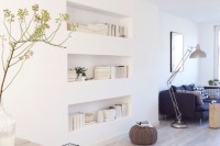 a sleek wall with a series of niche shelves is a stylish idea for a modern, Scandinavian or contemporary space