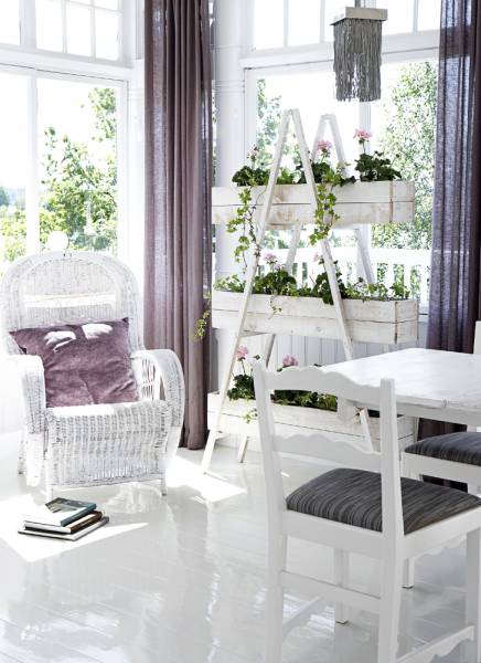 Sunrooms are perfect places to grow some greenery. For example you can create a DIY herb garden there. Btw, white furniture, walls and floors are perfect to make the room even more brighter that it already is.