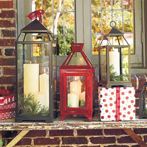 Do you have a side table on your porch? If so, then an arrangement that consists of candle lanterns, evergreen and presents would be perfect for it. 