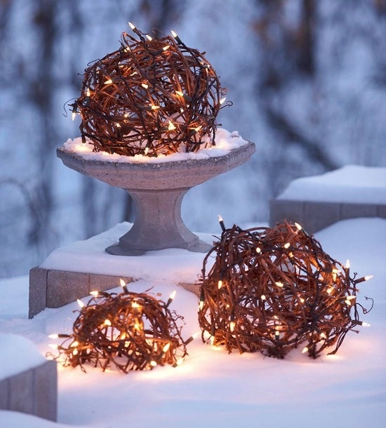 Here is a cool idea for a DIY solution to illuminate your garden or to create a beautiful focal point there. Purchase artificial wire or sisal balls from a garden centre. Create an opening in each ball. Next, carefully put some Christmas lights into each of them. Power them up with an extension cord and enjoy!