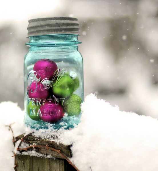 Fill a mason jar with a handful of brightly colored ornaments and place it anywhere in your back or front yards.