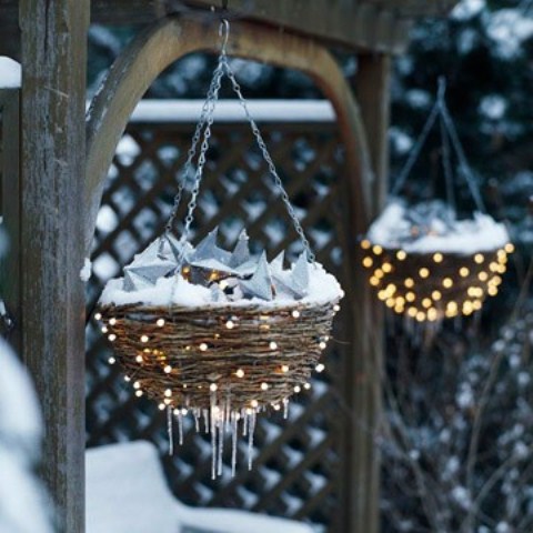 If you have hanging flower baskets put some ornaments in them a cover with string lights. That will provide additional festive mood to your garden.