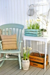 potted blooms and pussy willow for a fresh and vintage spring porch look