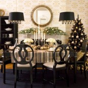 a luxurious gold and black Christmas table decor