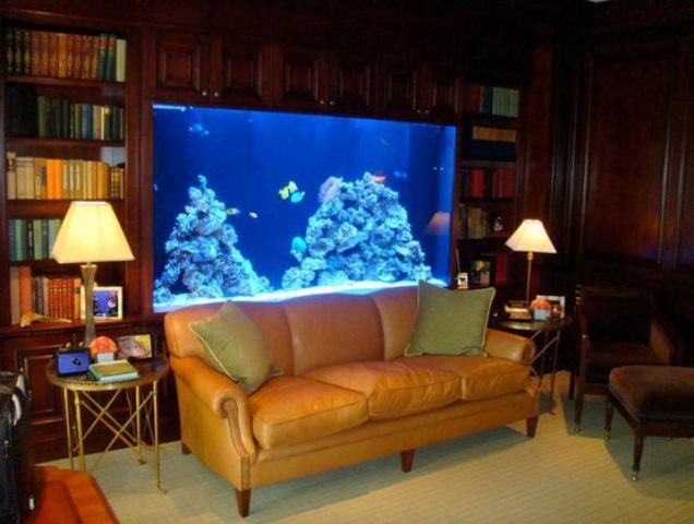 A refined library with a built in aquarium as a lovely and stylish decor feature