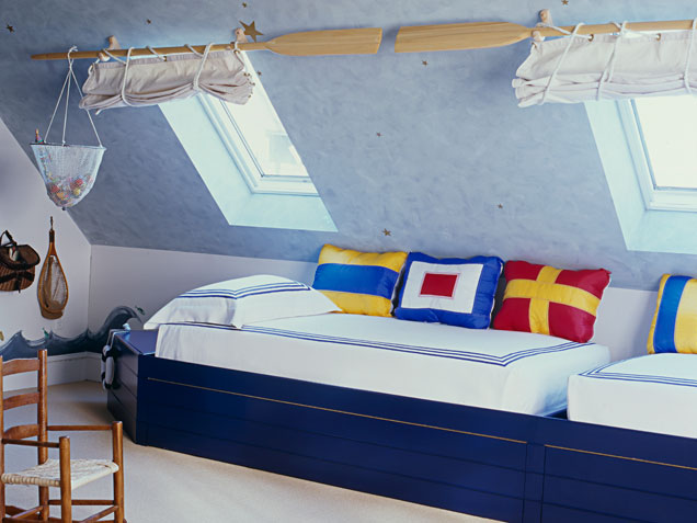 Attic boys bedroom for two toddlers in nautical theme.