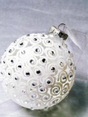 a frosted glass Christmas ornament with beads is a cool idea for winter wonderland home decor