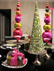 colorful Christmas ornament topiaries and a sparkling green sequin Christmas tree cone