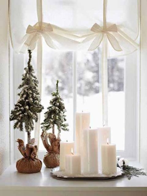 A bunch of candles and several little faux Christmas trees covered with faux snow would look great on any windowsill. 