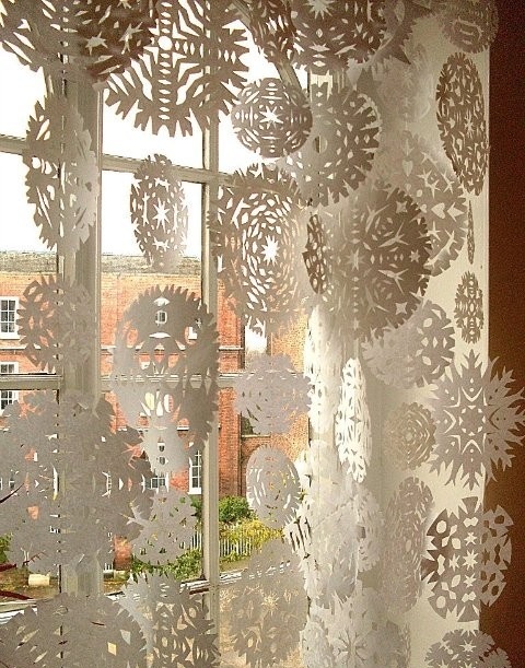 Snowflakes cut of paper is the cheapest way to decorate your windows and a really cool craft project for kids.