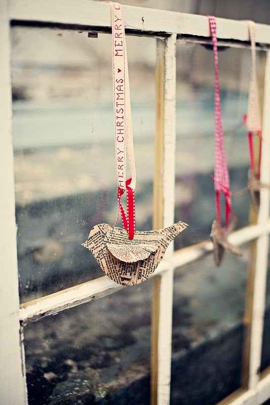 For a vintage, rustic touch cut something cool from old newspapers and hang it on a window.