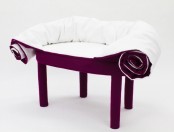 a purple and white chair with blanket built-in, you may use it for covering yourself completely or partly, for more coziness