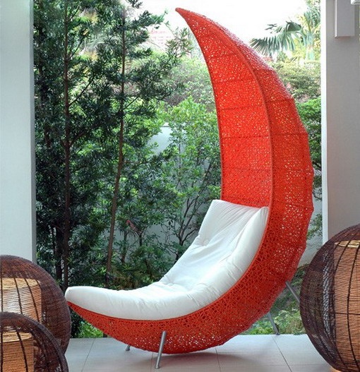 a bold red woven chair with an extended back, a white seat placed inside will be a nice idea not only for indoors but also for outdoors