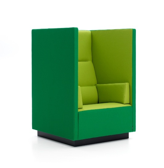 a tall chair in emerald and light green, with tall sides, allows to feel more intimate when sitting, perfect for introverts