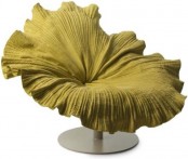 a bright yellow chair that reminds of a flower blooming is a unique idea that can be applied to many interiors, especially romantic ones