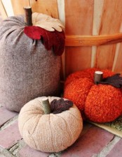 bright and neutral fabric pumpkins with stems and felt leaves are fun and cool for fall decor