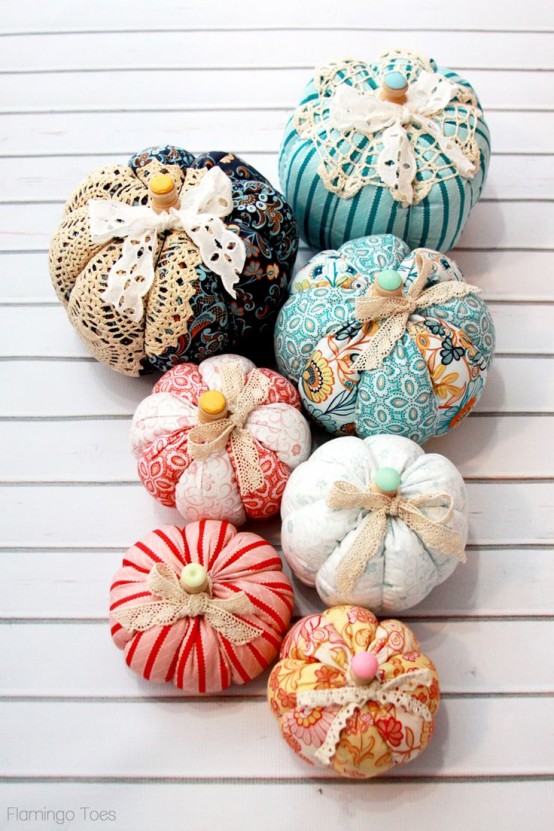 colorful fabric pumpkins of bright printed fabric, with lace ribbons and bright buttons are amazing for fun fall decor