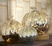 mercury glass pumpkins will bring a shiny glam touch to the space and a vintage feel at the same time