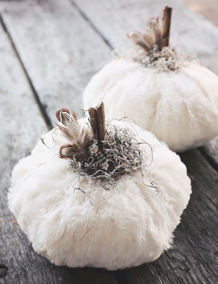 White faux fur pumpkins with stems, hay and embellishments are amazing for decorating a space and make it bright and glam