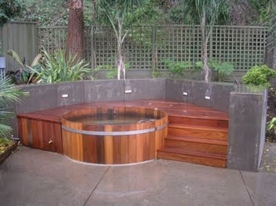 If you don't want an in-ground hot tub then don't forget to add stairs to yours. They will help you to get in without any troubles.