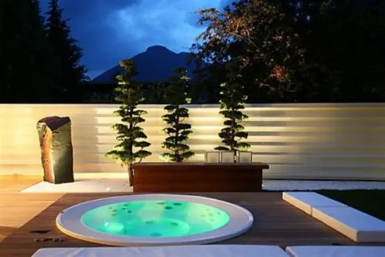 An outdoor Jacuzzi tub is a great addition to your backyard if the climate isn't too harsh.