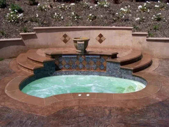Maroccan tiles is a great idea to decorate your garden hot tub.